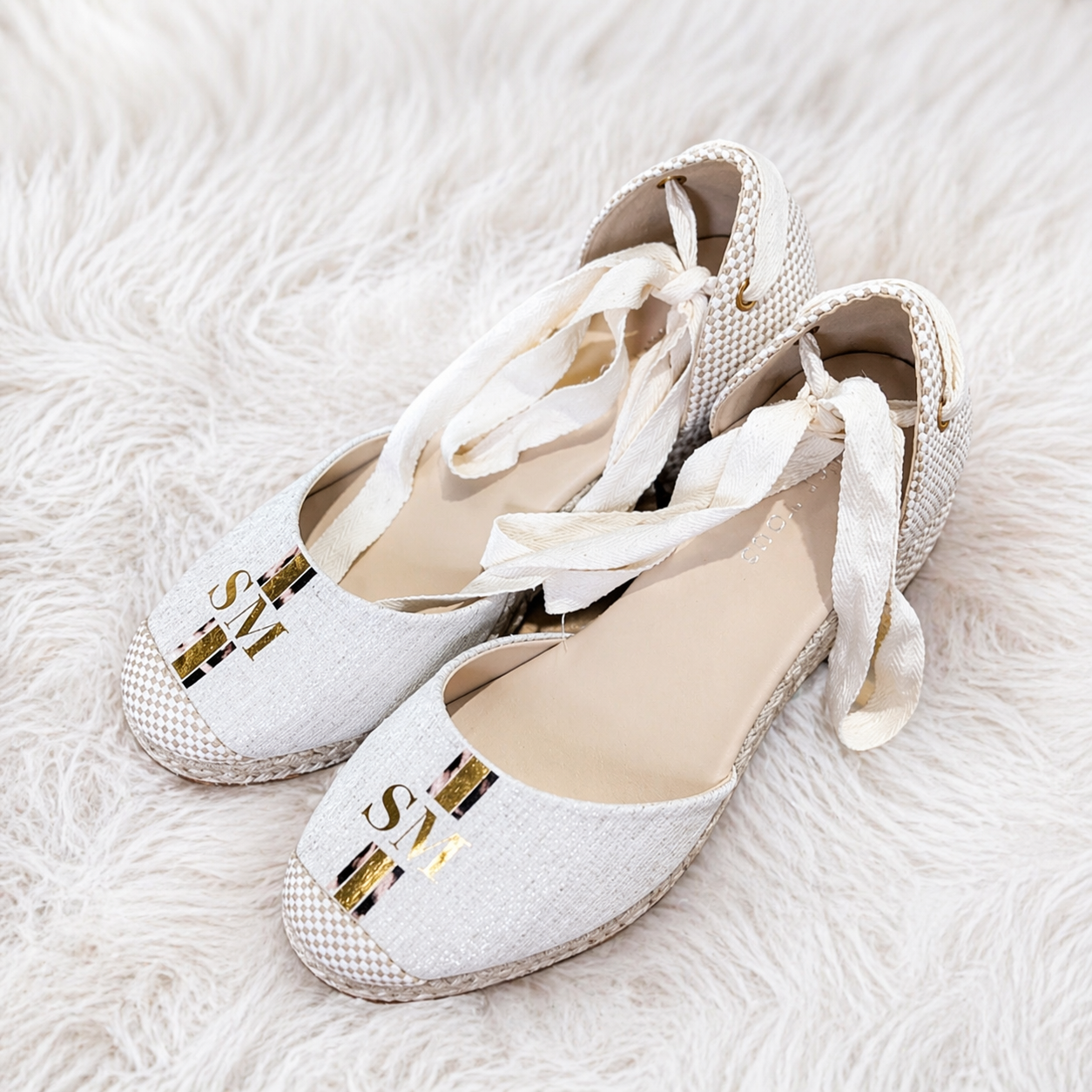 Custom personalised monogram shoes featuring elegant ribbon tie detail and gold initial design on the toe