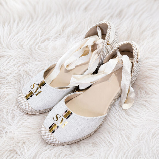 Custom personalised monogram shoes featuring elegant ribbon tie detail and gold initial design on the toe