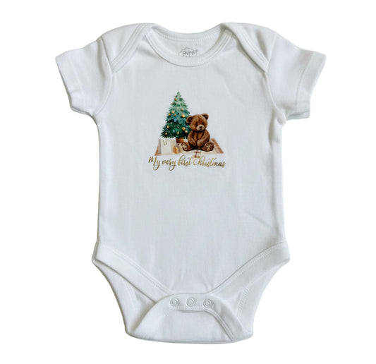 White baby onesie with a Christmas design featuring a bear and tree, on a white background.