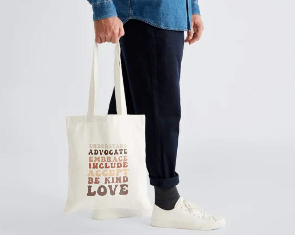 Neutral cotton tote bag with Understand Advocate Embrace Include Accept Be Kind Love design from The Inclusion Initiative, 42×38cm.