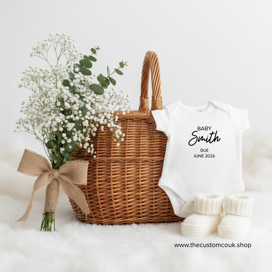 Personalised new baby announcement baby grow with custom printed text.