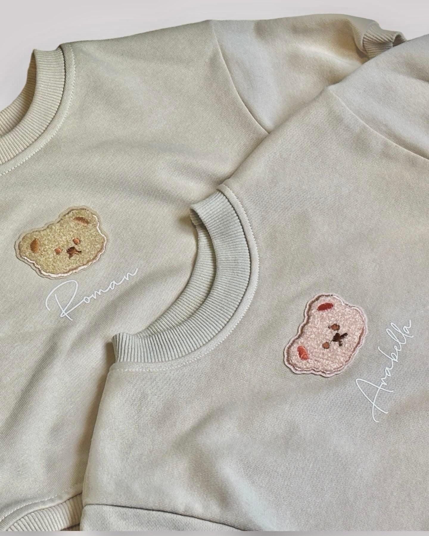 Personalised teddy bear romper sweater with embroidered bear design and custom baby name.