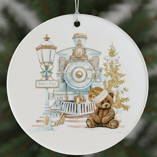 Christmas ornament with a teddy bear, train, and North Pole sign